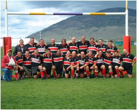 Group photo of Old Boys men's Abbotsford rugby club team, smiling and posing in their jerseys